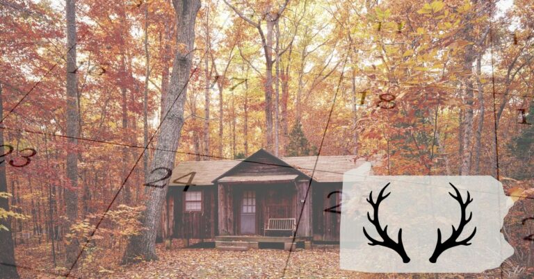 Hunting camp in the fall with outline of PA state and antlers in the bottom right